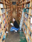 Jenny in Powell's Books in Portland, OR, with Number9Dream in hand