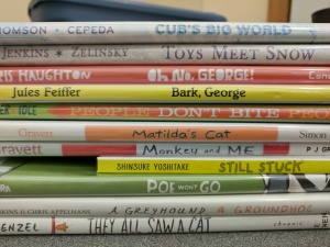 Picture books piled up for storytime