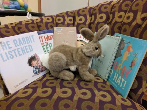Rabbit puppet and six picture books on the storytime chair